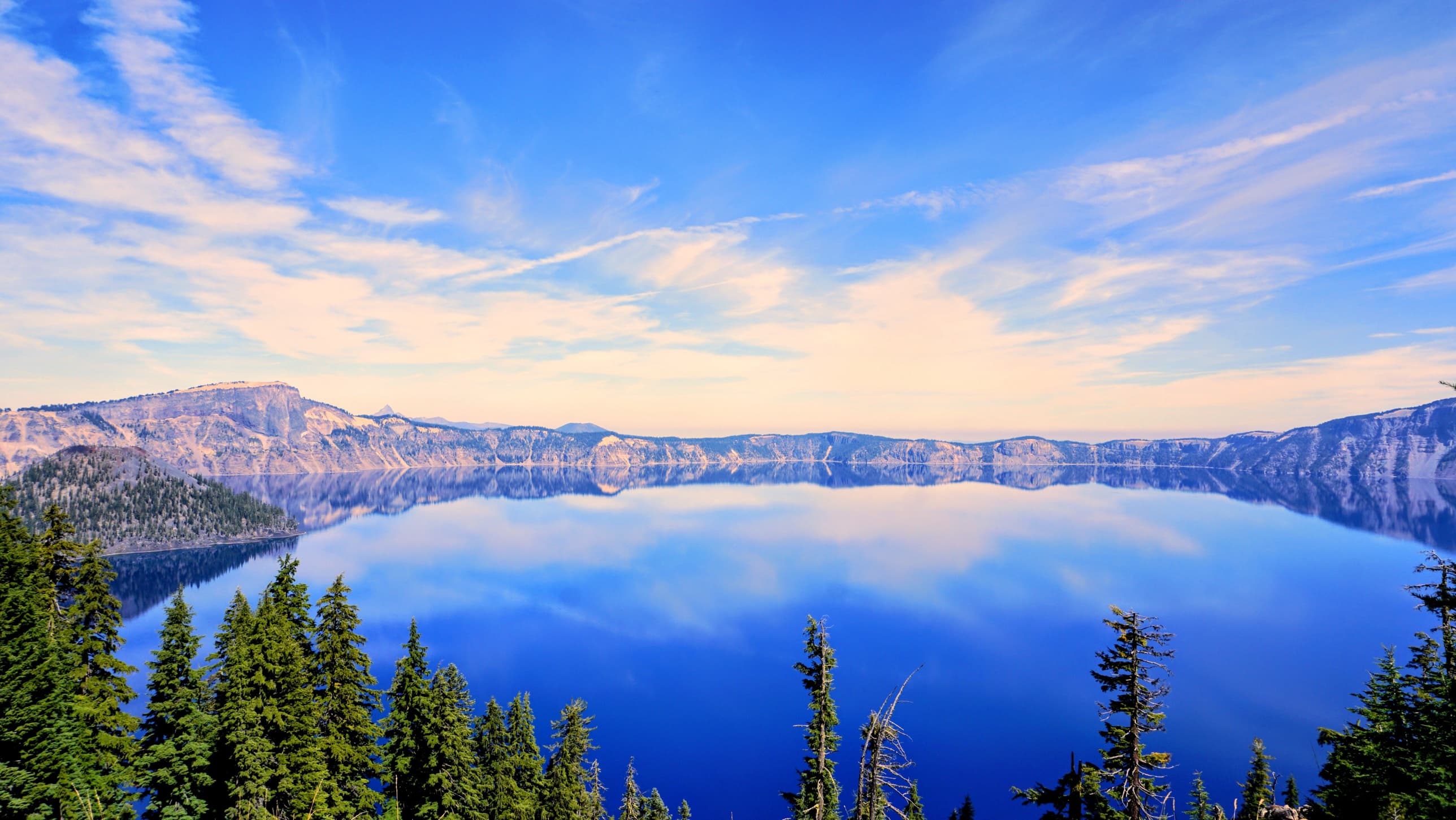 Clouds and cliffs mirrored on the lake