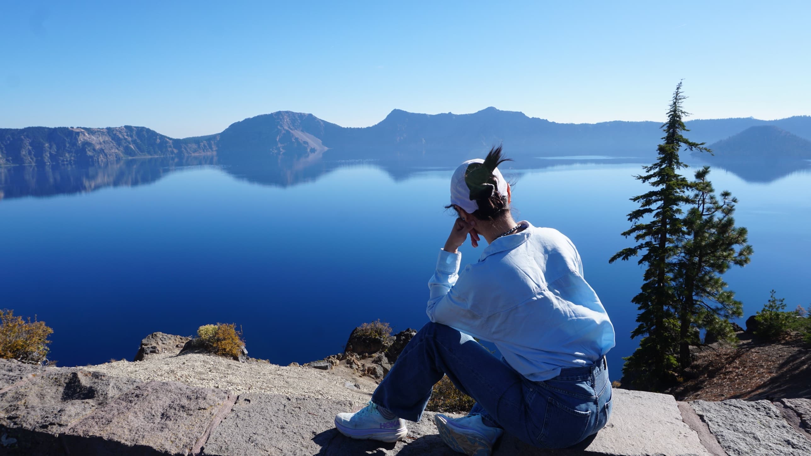 Sitting on the stone wall, looking out at the lake