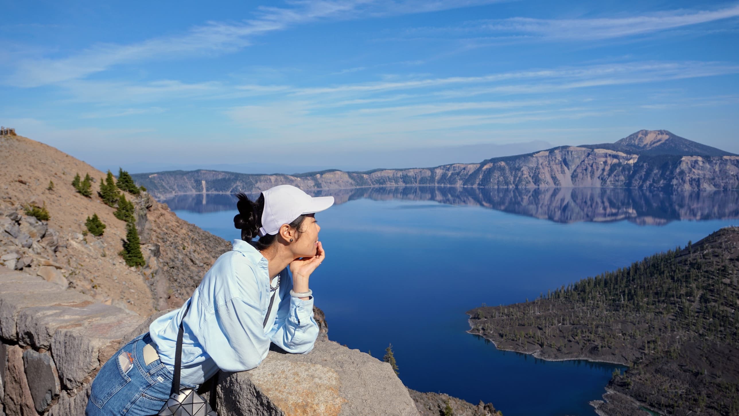 Leaning on the stone wall above Wizard Island